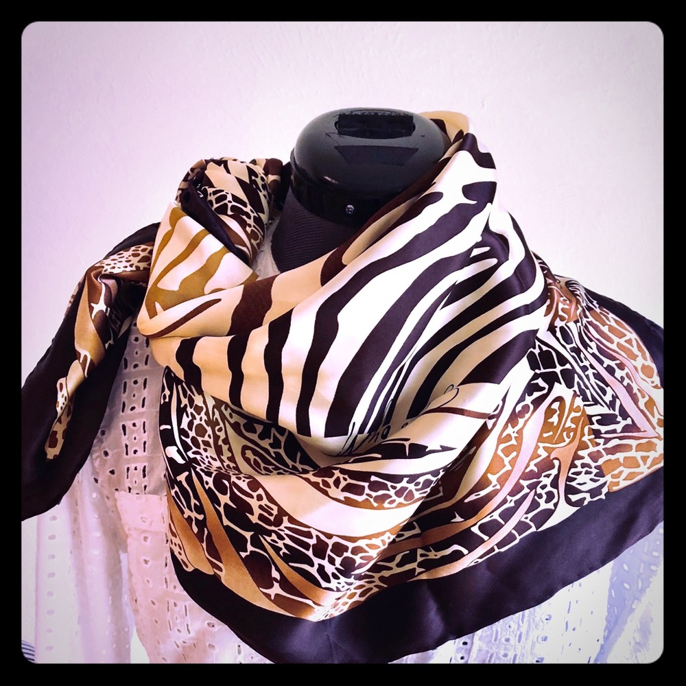 Scarf by Marciano. 100% silk.